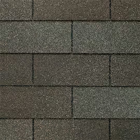 A detailed shot of dark grey 3-tab shingles