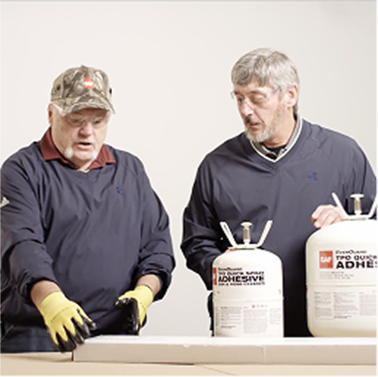 GAF certified contractors Dave Scott and Wally Brown presenting portable GAF EverGuard TPO QuickSpray adhesive canisters.