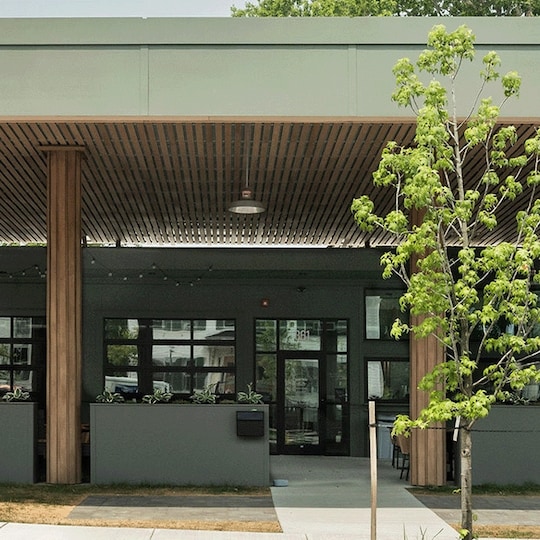 Exterior view of The Getty Bagel Shop, a renovated 1952 gas station featuring a modern EverGuard® PVC roof.