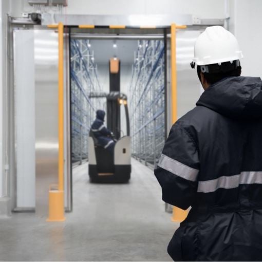 Two people working in cold storage facility