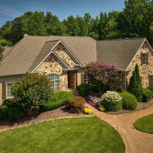 Bird’s eye view of a house built with impact-resistant Timberline ASII shingles