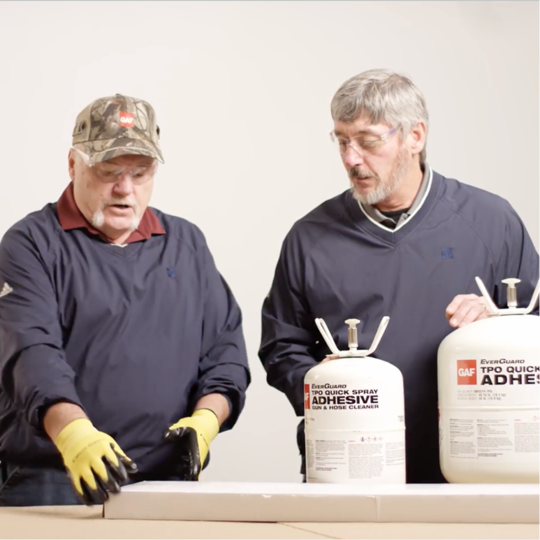 Dave Scott and Wally Brown presenting GAF EverGuard QuickSpray and LRF Adhesive XF canisters.