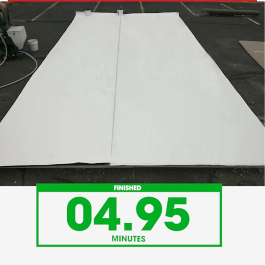 Side-by-side time-lapse demonstration comparing application speeds of GAF commercial roofing adhesives.