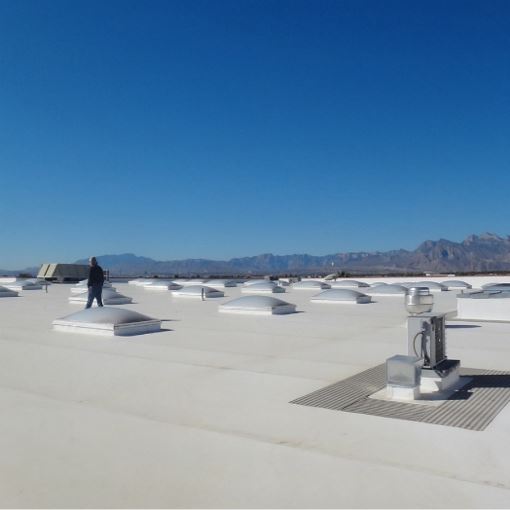 Gaf commercial contractor on top of flat roof with EverGuard TPO