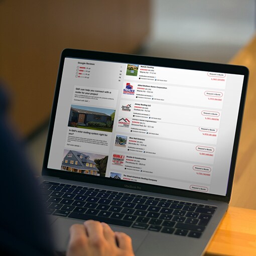 A homeowner browsing a directory page of roofing contractors 