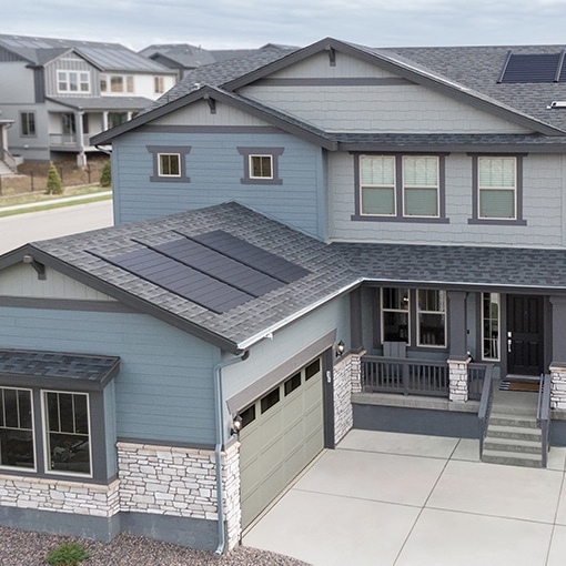 Bird’s eye view of a house that a building developer built with the Timberline solar roof system. 