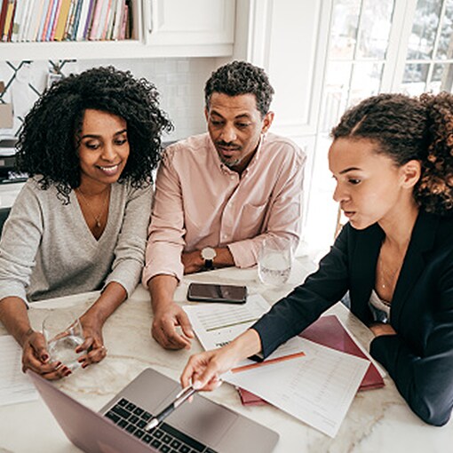 An insurance carrier representative and homeowners discuss how to handle a storm restoration claim after a storm. 