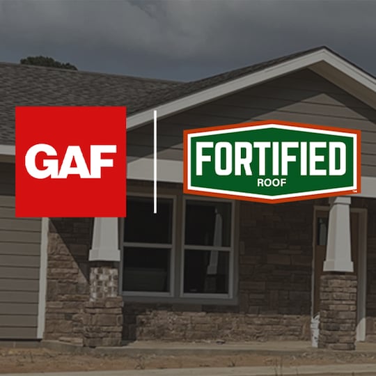 The GAF logo and the Fortified Roof logo displayed above a house. 