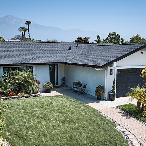 Home with gray Timberline HDZ® RS roofing shingles that meet the criteria of the FORTIFIED™ Program.