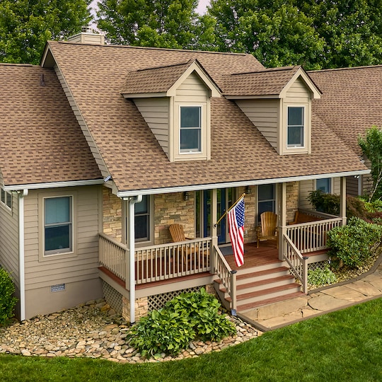 A light stone home with Timberline HDZ® Shingles