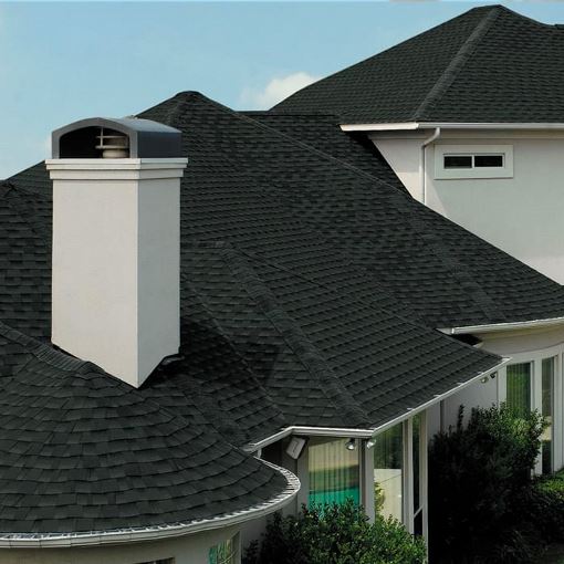 Large white home with black GAF roof 