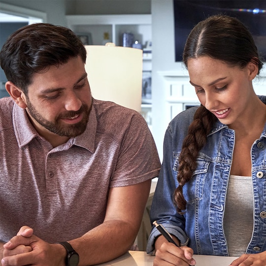 Homeowners reviewing residential warrenties