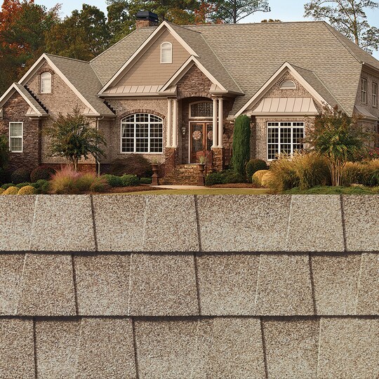 GAF Timberline HDZ® Golden Amber Shingle closeup with sample product image on a brick house.