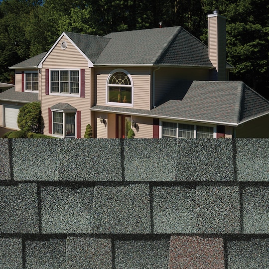 GAF Timberline HDZ® Williamsburg Slate Shingle closeup with sample product image on a beige house.