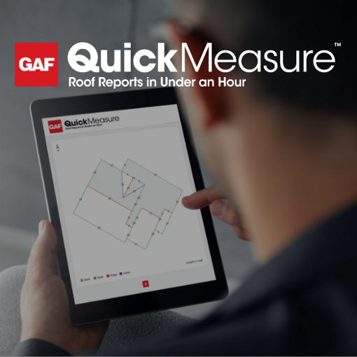 Roof contractor holding tablet open to QuickMeasure roof measurements by GAF