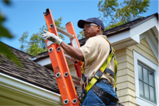 GAF certified roofer on ladder