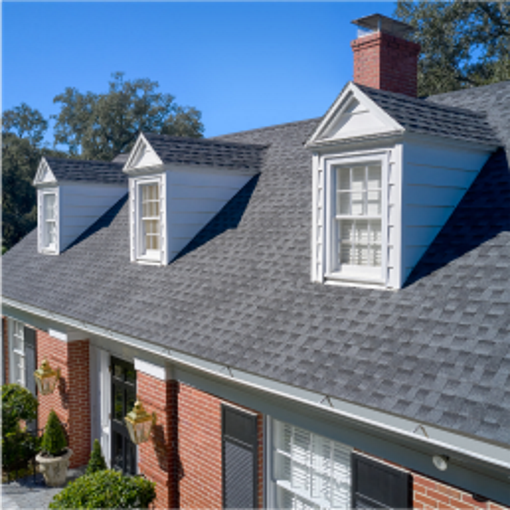 Roof with GAF shingles and warranty badge