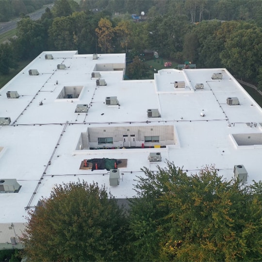Aerial view of completed school rooftop using GAF commercial roofing system 