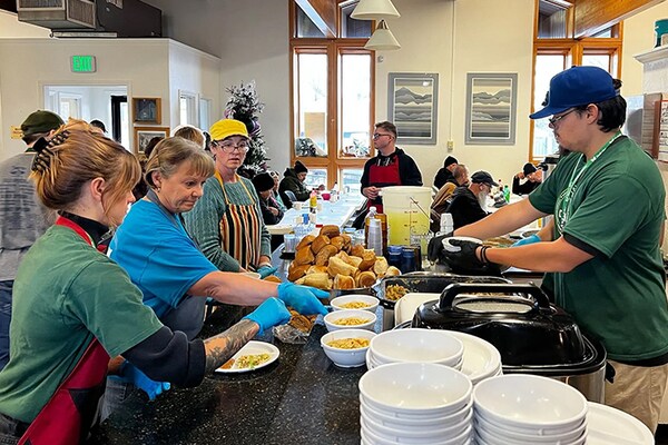 Several members of the DaBella team volunteering at a local soup kitchen