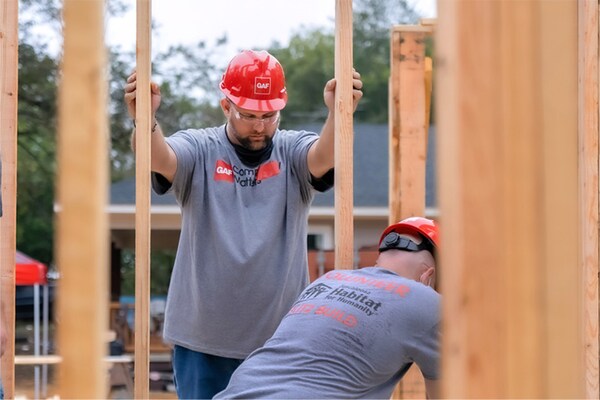 Contractors installing wood frames at a Habitat for Humanity site.