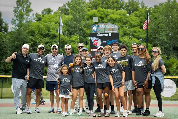 The Feazel Foundation team at a communities event — The Feazel Foundation supports veterans, youth sports, local healthcare causes, and families.
