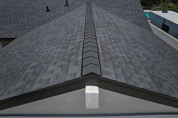 Bird's eye view of a residential roof with GAF Timberline HDZRS shingles installed.