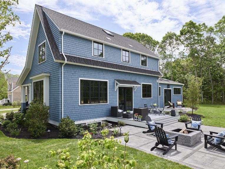 Light blue house with gray GAF shingle roof