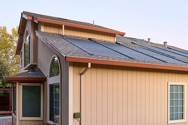 A residential house with GAF Energy Timberline Solar® ES 2 over GAF Timberline HDZ® asphalt shingles