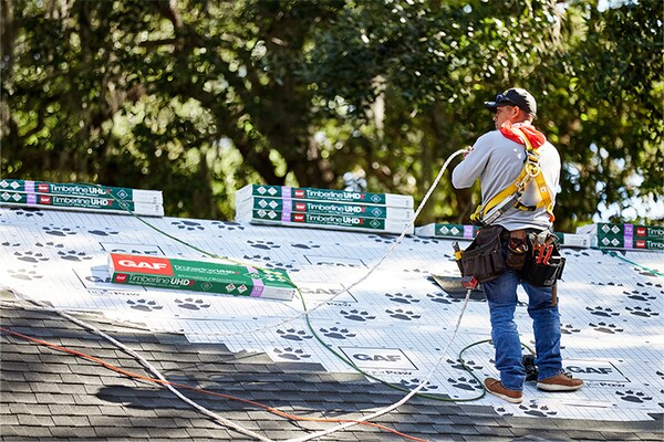 A GAF National Circle™ contractor installing a new roofing system on a residential property.