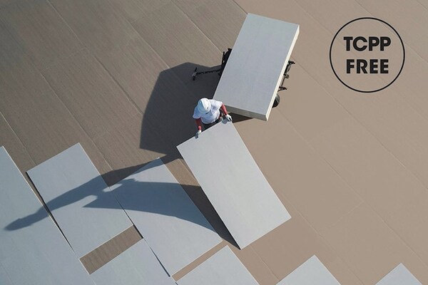 An aerial shot of a GAF certified contractor laying sheets of TCPP-Free insulation on a flat roof.