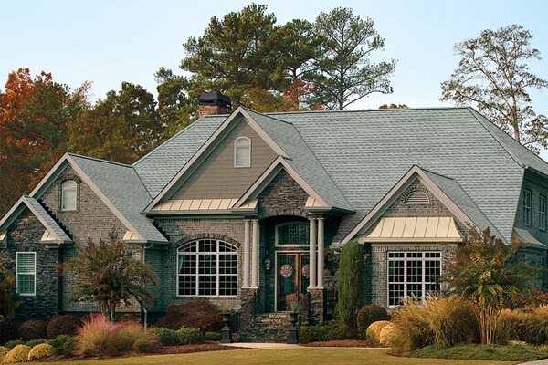 Home with light gray GAF roof shingles