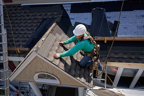 GAF certified roofing contractors installing a new roof system