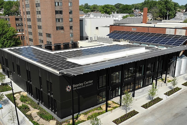 An aerial photo of the Stanley Center roof covered in solar panels.