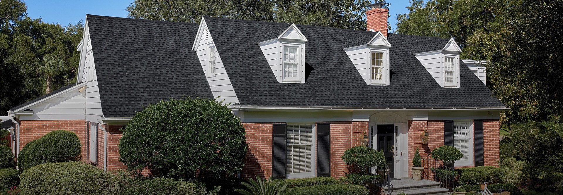 Residential home with Charcoal shingles made by GAF
