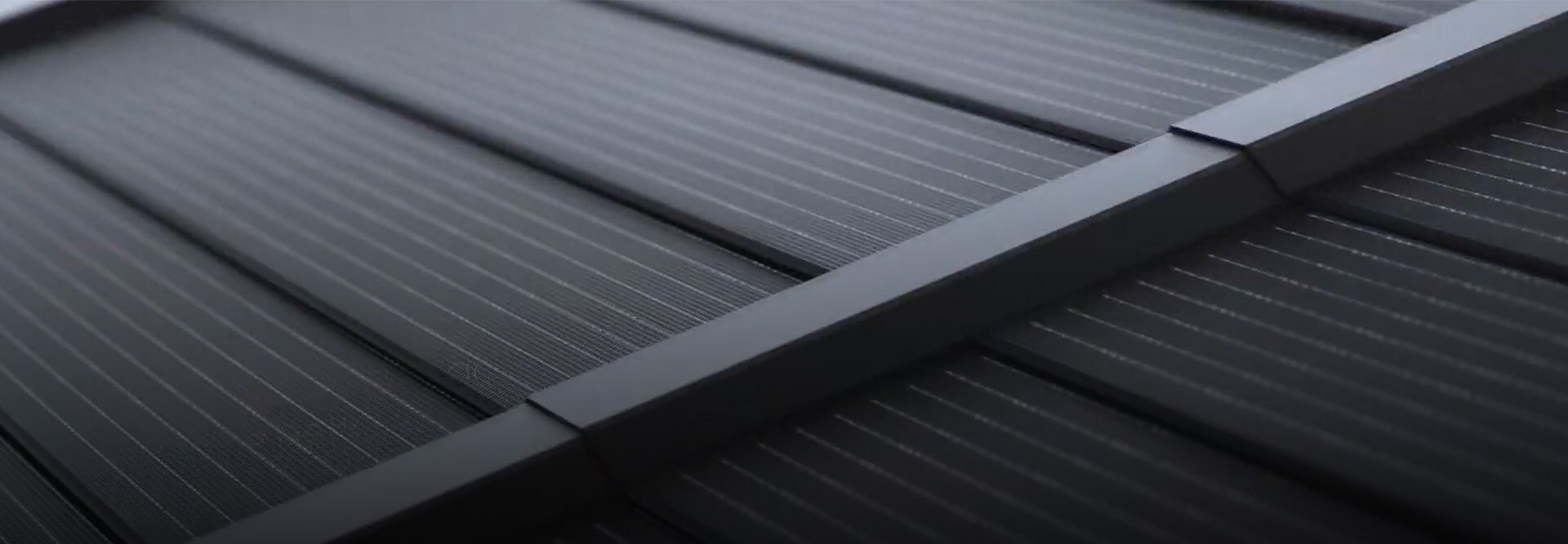 Closeup photo of solar tiles that are part of the Solar Timberline Roofing System. 