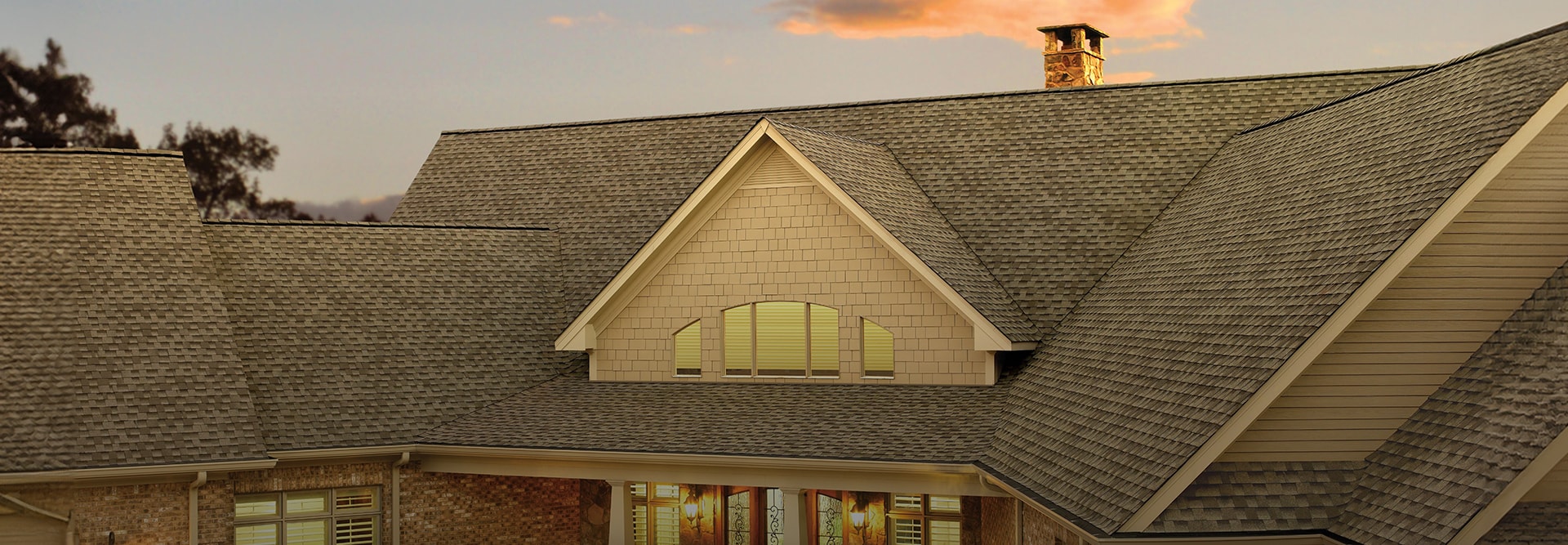 Residential home with Weathered Wood shingles made by GAF