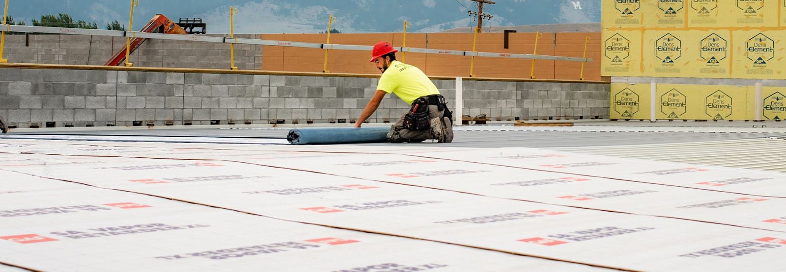 GAF certified contractors rolling out the new roof of Bozeman Public Safety Center in Montana