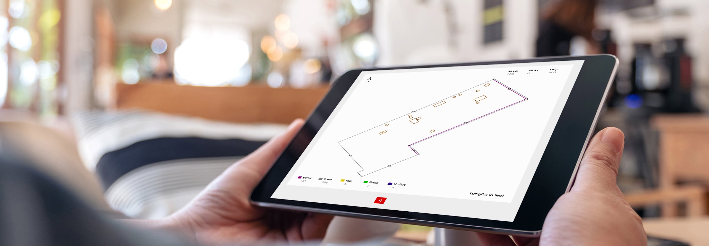 Person viewing house layout from QuickMeasure on a tablet.