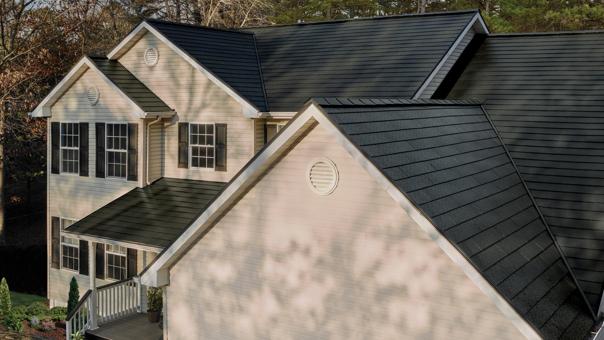 Close-up of TimberSteel metal roof on home with ArmorPledge Warranty badge