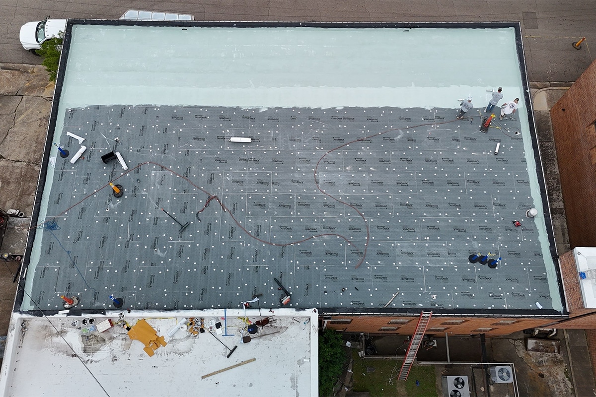 GAF Certified commercial roof contractors applied the layers of the silicone roof system.