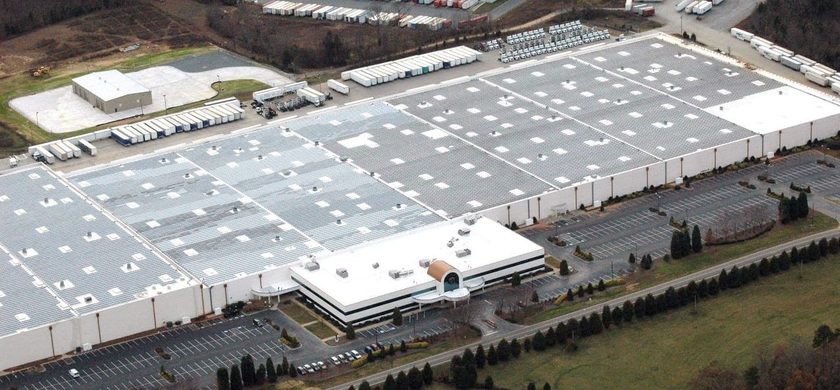 Front aerial image of Shoe Show INC in NC with a new Hydrostop roof coating system