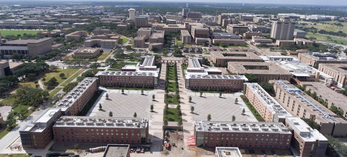 Front aerial view of Texas A&M University dorm buildings with new flat roofs using GAF roof coatings