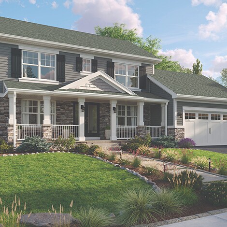 Sideview of a house with a roof built with GAF-manufactured Slate shingles
