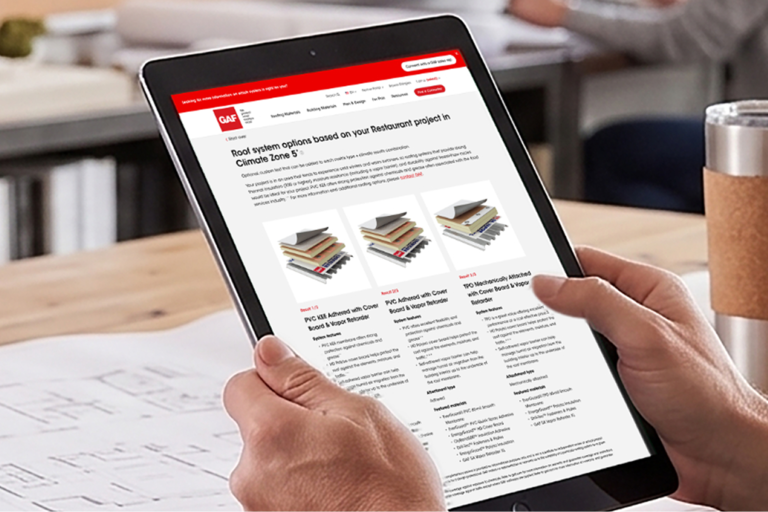 A user reviewing customized commercial roof assembly options on a tablet using the GAF Commercial Roof Selector tool.