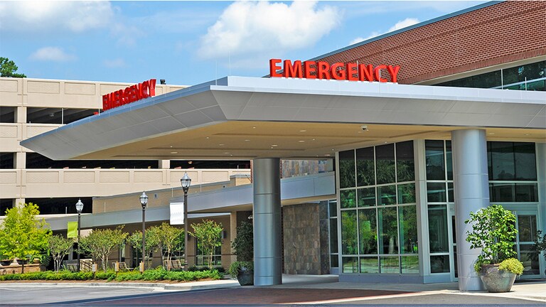 The outside of the emergency wing of a hospital.