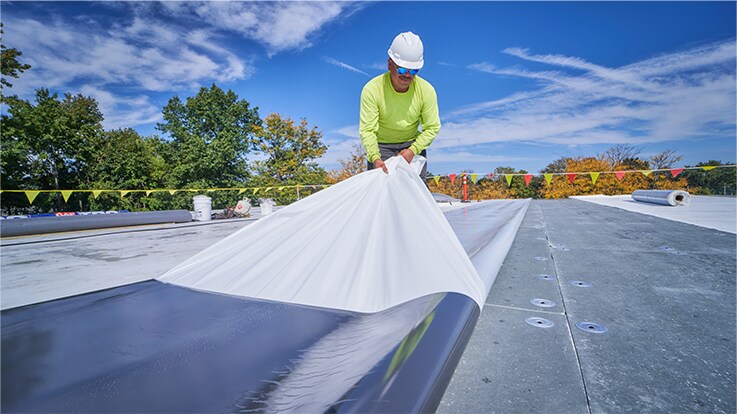 Commercial roofing contractor installing GAF TPO