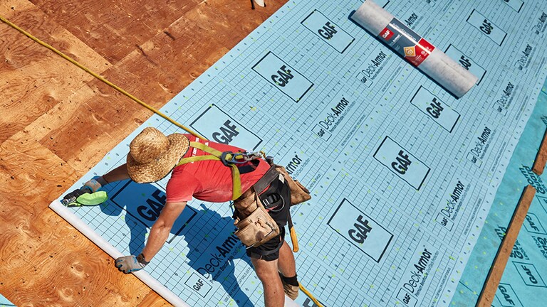 Contractor sealing the roof deck on a GAF Fortified roof