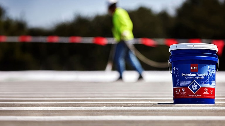 Bucket of GAF Premium Acrylic HydroStop® Liquid Membrane System.
