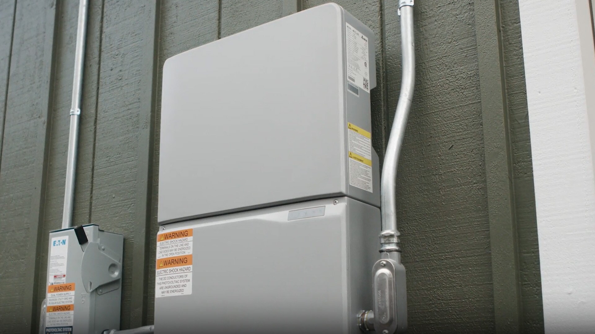 Video thumbnail showing a close up of an electrical box at the back of a house. 