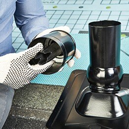 Contractor turning Pivot cap clockwise to ensure Master Flow Pivot roof vent boot is locked.